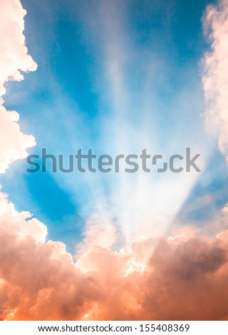 Heaven light ray from sun behind cloud in the blue sky