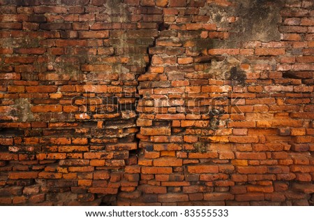 Cracked ruin and dirty orange brick wall vertical