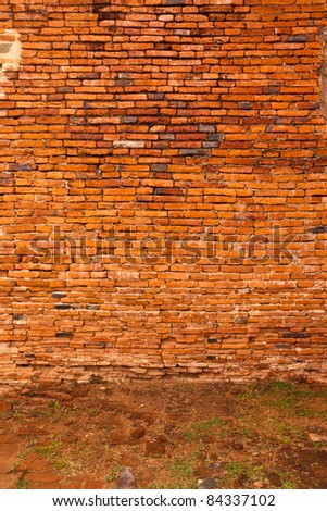 Ruin and ancient  orange brick wall surface background texture vertical