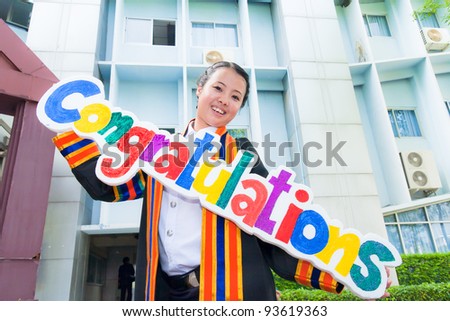 Asian graduation women smile with congratulation sign