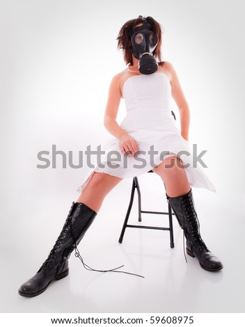stock photo Woman in Wedding Dress with Gas Mask and Boots on