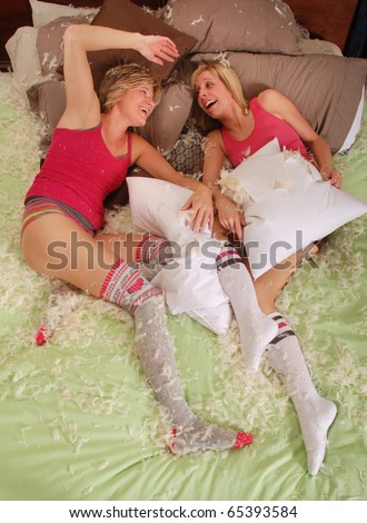 Two Young Women Resting after a Pillow Fight