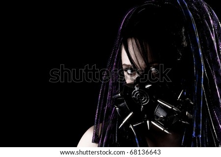 Beautiful Grunge Girl with Spiked Gas mask and Dreadlocks.