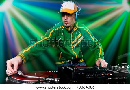 DJ with table and Club Lights in the background