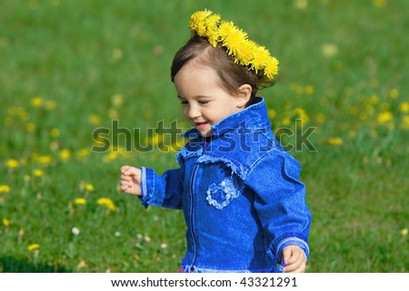 Baby girl with spring wreath