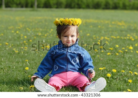 Baby girl with spring wreath