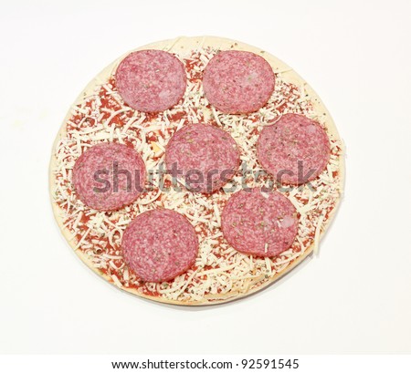frozen pizza with salami and cheese isolated on white background