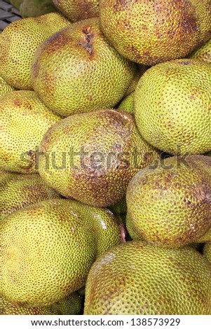 Pile of jack fruits in local fruit market of Thailand