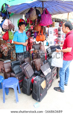VIENTAINE, LAO P.D.R. - AUGUST 25 : Shoppers visit duty free shop at Thai-Lao border on August 25, 2013 in Vientaine, Lao P.D.R.
