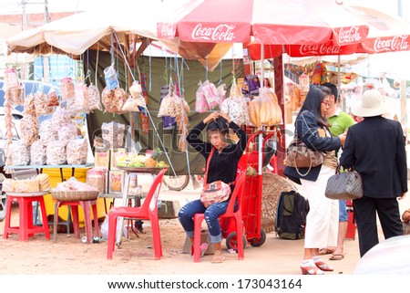 KA LAN, CAMBODIA - NOVEMBER 23 : Unidentified Khmer woman is selling foods at local market on November 23, 2013 in Ka Lan, Cambodia.