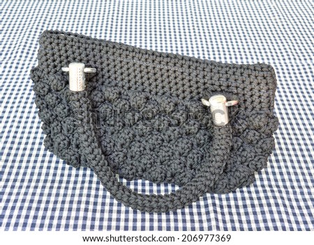 pretty nylon handbag on cotton cloth