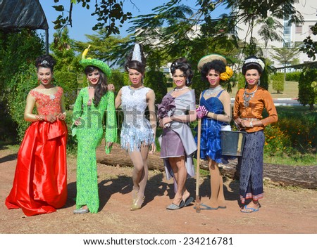 MAHASARAKHAM - NOVEMBER 24 : Students in fancy dress take photo at rice field in Mahasarakham University harvesting tradition on November 24, 2014 in Mahasarakham, Thailand.