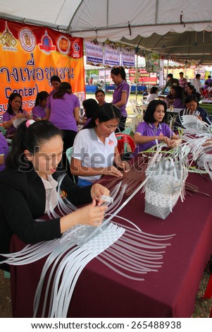 MAHASARAKHAM - MARCH 9 : Group of women learn to weave plastic basket at Fix It Center public exhibition on March 9, 2015 in Mahasarakham, Thailand.