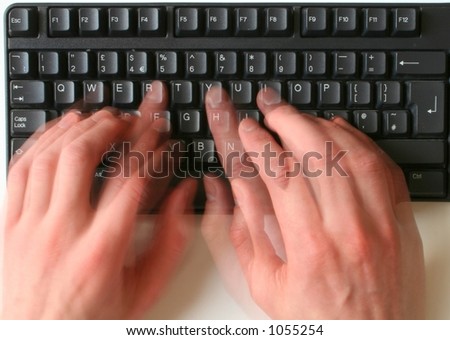 Typing hands blurred (slow shutter speed)