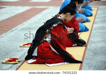 OKINAWA, JAPAN - JANUARY 1: women sit and pay reverence to King during ancient new year ceremony reenacted at Shurijo castle on January 1, 2011 in Okinawa, Japan.