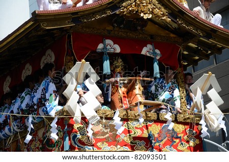 KYOTO, JAPAN - JULY 17: Gion matsuri is traditional most famous festival on July 17, 2011 in Kyoto, Japan. This festival has a history of over 1,000 years, and men move a float after cutting the rope.