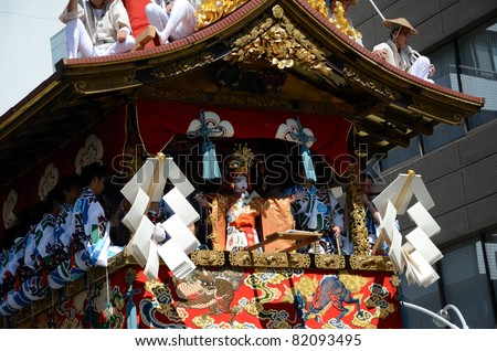 KYOTO, JAPAN - JULY 17: Gion matsuri is traditional most famous festival on July 17, 2011 in Kyoto, Japan. This festival has a history of over 1,000 years, and men move a float after cutting the rope.