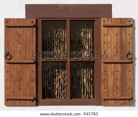 Spanish Style Window With Shutters With Coconut Shell Curtains