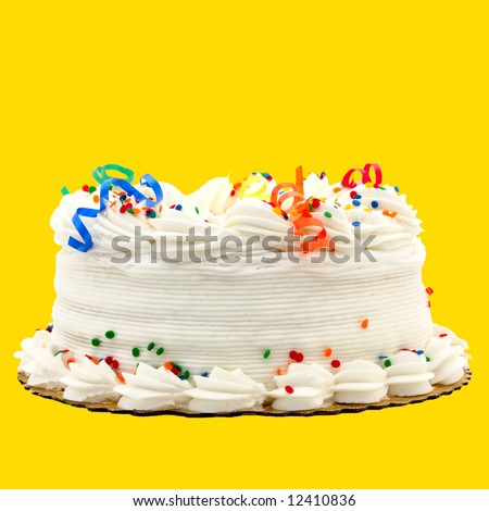 Delicious White Vanilla Birthday Cake With Red, Blue, Green, Yellow and Orange Decorations ~ Isolated On Yellow Background