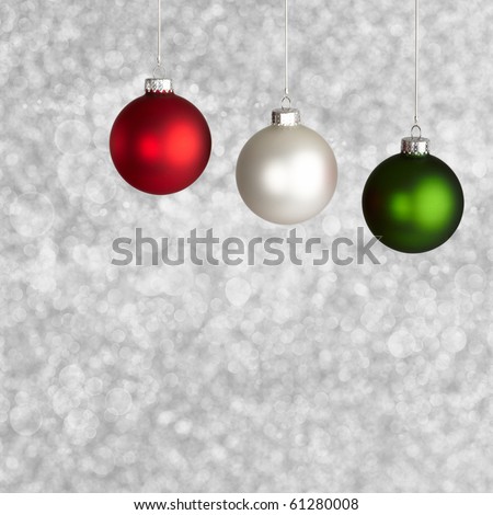 White, Red and Green Christmas Ornaments On Silver Bokeh Background