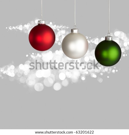 White, Red and Green Christmas Ornaments On Gray And White Bokeh Background