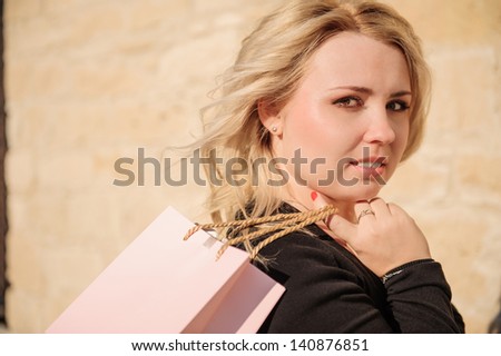 Blond Lady with shopping bag