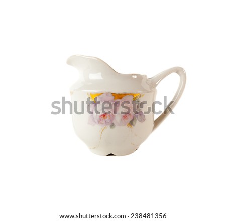 Porcelain Gravy boat with Rouse ornament isolated over white background