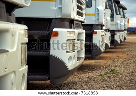 Cropped, narrow focused fleet of trucks