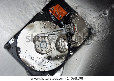 Hard Drive under tap water. Concept of Cleaning your Hard Drive.