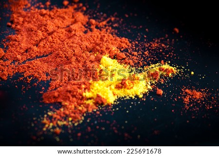 Assorted spices on black background