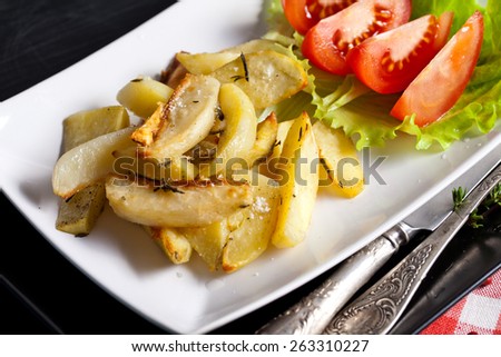 Potato wedges with species on serving plate