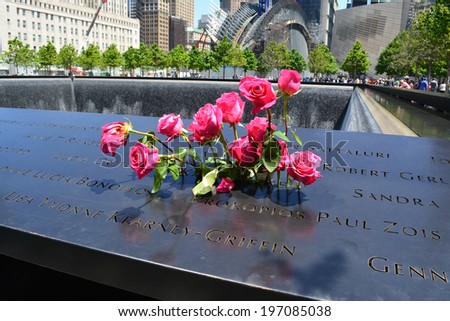 NEW YORK CITY, USA - June 2, 2014: Flowers left at the National 9/11 Memorial at Ground Zero in Lower Manhattan.