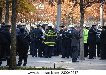 New York City, USA - November 12, 2014: Emergency workers gathered below Word Trade Center Tower One because of a collapsed scaffolding dangling from the building  in New York City.