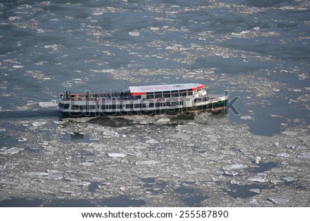 New York City, USA - February 24, 2015: Circle Line cruise ship on the frozen East River as record low temperatures continue in New York City.
