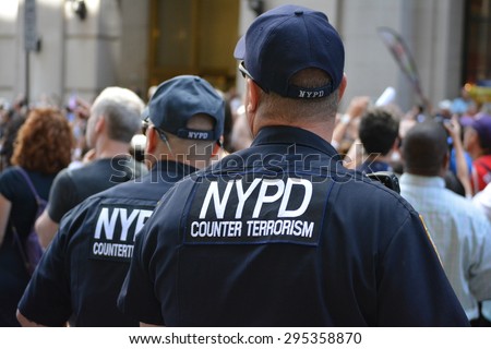New York City, USA - July 10, 2015: Members of the NYPD protecting the crowd at the  Women\'s World Cup championship victory parade in New York City.