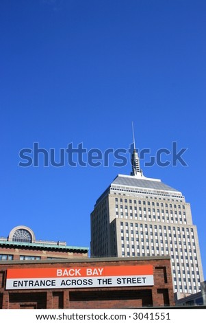 Boston\'s Old John Hancock Building and the entrance to the Back Bay T (subway) stop.