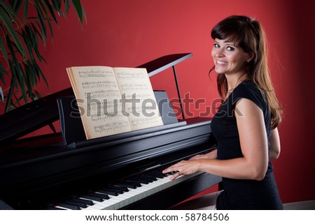 young woman playing piano 6976