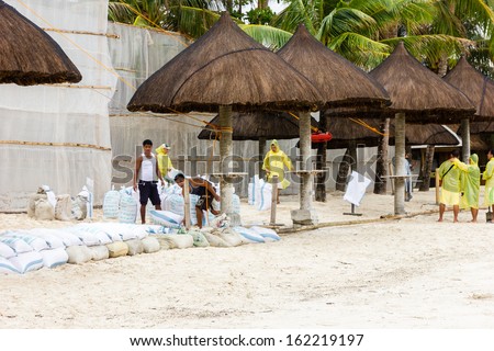 Boracay, Philippines - November 8 2013: Local Businesses Prepare Sand Bags As Super Typhoon Haiyan Approaches Land