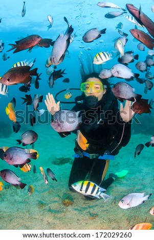 Happy Female Scuba Diver Underwater