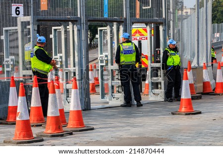 CARDIFF, WALES - SEPTEMBER 3 2014: A huge security operation is underway around the venues for the NATO summit.  Thousands of police and tens of miles of fencing have been deployed in the operation