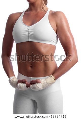 Fit and muscular young caucasian woman doing a power pose with boxing wraps