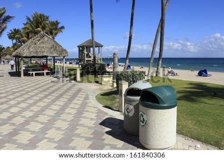 Deerfield Beach, Florida - February 1: Garbage And Recycling Cans, Along With A Recycling Program That Started In 1988, Helps Keep A Busy Beach Clean On February 1, 2013 In Deerfield Beach, Florida.