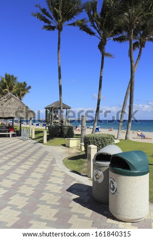 DEERFIELD BEACH, FLORIDA - FEBRUARY 1: Garbage and recycling cans, along with a comprehensive city recycling program helps keep a busy beach clean on February 1, 2013 in Deerfield Beach, Florida.