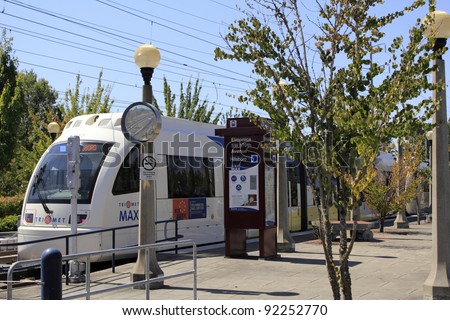 BEAVERTON, OREGON - AUGUST 3: Light rail electric MAX train at the Elmonica station on August 3, 2010 in Beaverton, Oregon. An average of 127,000 people per week day ride the MAX trains.