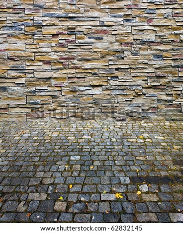 nice decorative stone wall and old time brick pavement collage contrast old cobbles and new  decorative stones