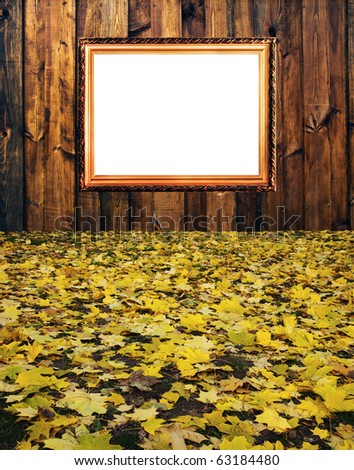 russian vintage elegant frame on wooden rough planks background and nice maple leaves foreground concept dissonance of elegant old thing and modern brutal
