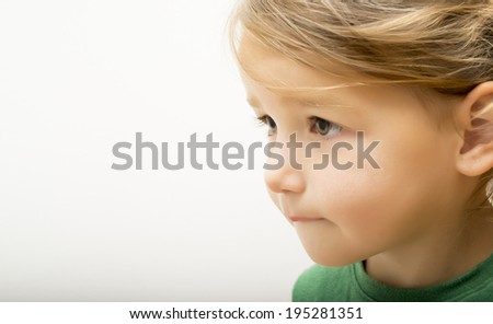 Side portrait of beautiful little girl
