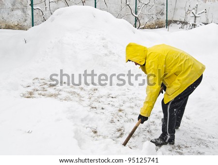 Shoveling snow in winter