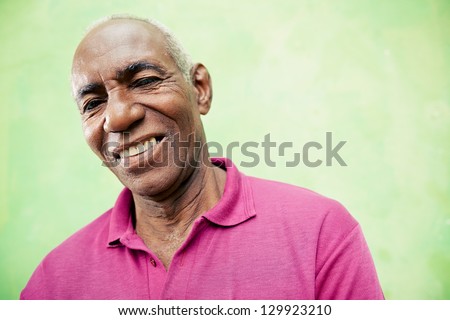Old people and emotions, portrait of senior african american man looking and smiling at camera. Copy space