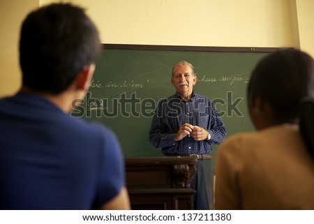 People and education, professor talking to students during lesson in college, Law School, University of Havana, Cuba
